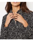 Reglissi-jurk gedrukt op een zwarte achtergrond