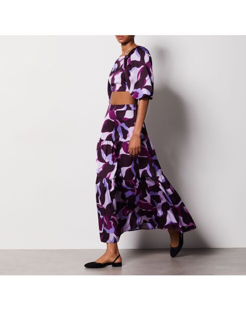 Falda Uzes estampada sobre fondo morado