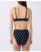 Klassischer BH ohne Bügel und mit Polky-Shell bedruckt auf schwarzem Hintergrund