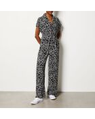 Aidyle Jumpsuit gedruckt auf schwarzem Hintergrund