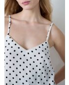 Camiseta sin mangas Elvis con estampado de lunares negros sobre fondo blanco