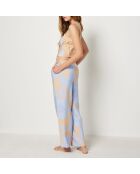 Magnoliabroek met blauwe achtergrondprint