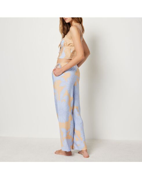 Magnoliabroek met blauwe achtergrondprint