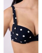 Klassieke push-up bh met beugel en polky shell gedrukt op een zwarte achtergrond