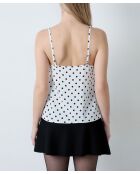 Camiseta sin mangas Elvis con estampado de lunares negros sobre fondo blanco