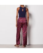 Pantalones blancos con estampado de fondo morado