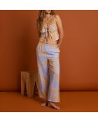 Magnoliabroek met blauwe achtergrondprint