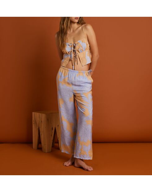 Magnoliabroek met blauwe achtergrondprint