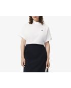 Polo asimmetrica con piqué bianco