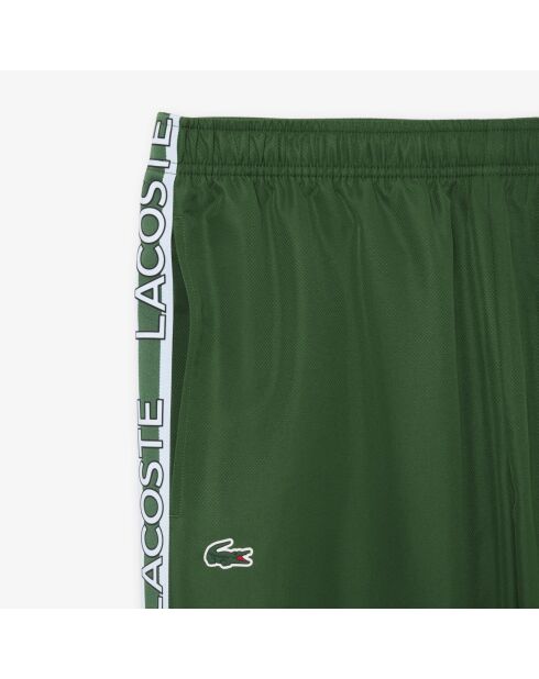 Pantalones deportivos de marca verde