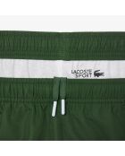 Pantalones deportivos de marca verde