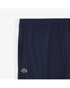 Sportjoggingbroek met kleurvlakken marineblauw/wit-calathea