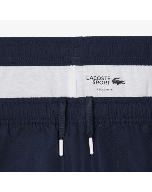Sportjoggingbroek met kleurvlakken marineblauw/wit-calathea