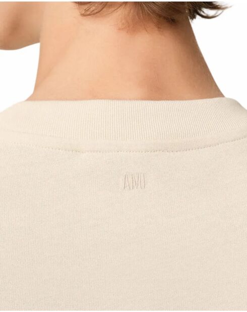 Beige T-shirt met hartvriendelijke patch