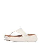 F-Mode teenslippers van crèmekleurig leer met plateauzool