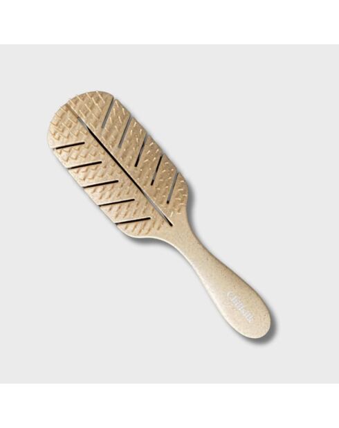El cepillo desenredante beige