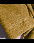 Asciugamano da bagno LT Oasis in cotone pettinato giallo senape - 100x150 cm