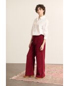 Pantaloni Torres in velluto granato