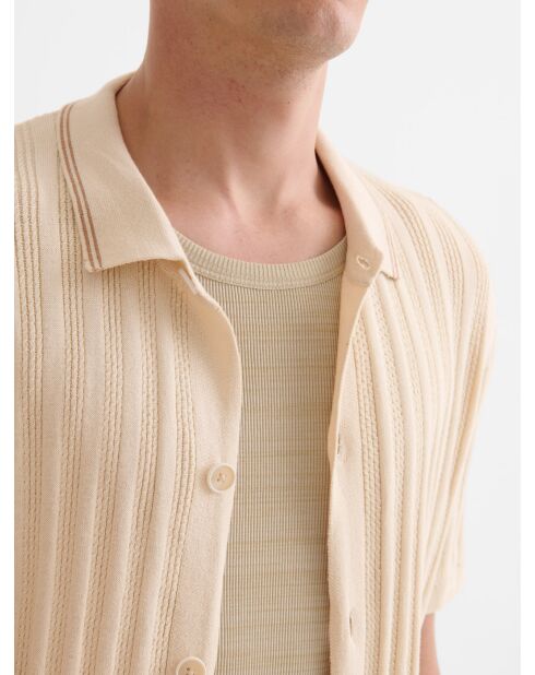Lichtbeige opengewerkte gebreide blouse met knoopsluiting