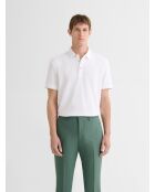 Witte polo met knopen in reliëf