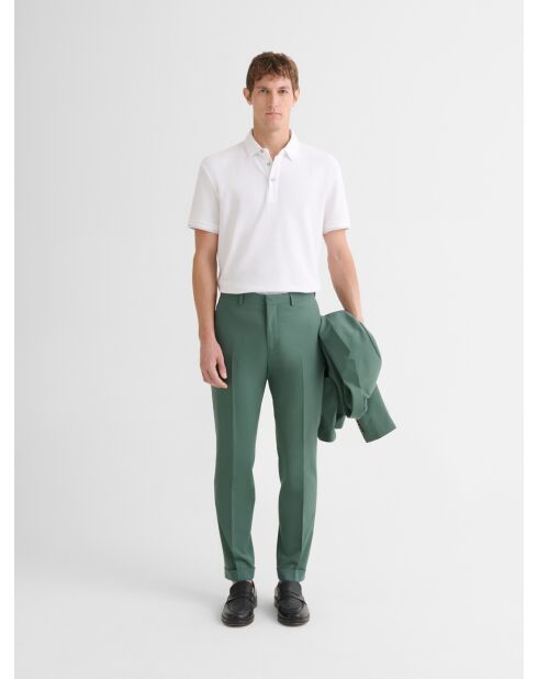 Witte polo met knopen in reliëf