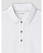 Witte polo met knopen in reliëf