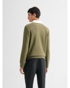 Polo manches longues col boutonné vert olive
