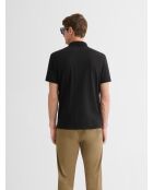 Polo boutonné gauffré noir