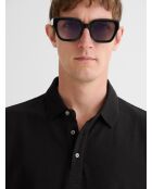 Polo boutonné gauffré noir