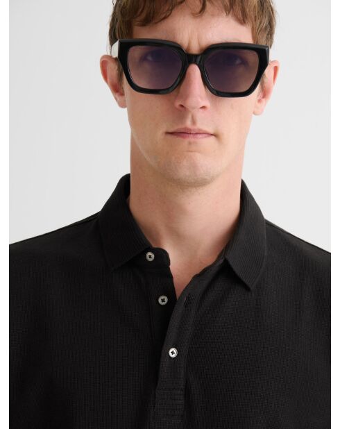 Polo boutonné gauffré noir