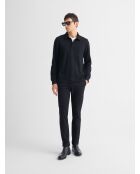Polo negro regular con botones