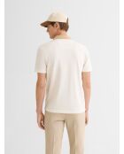 Polo abotonado en jacquard marfil