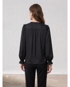 Top nero con volant