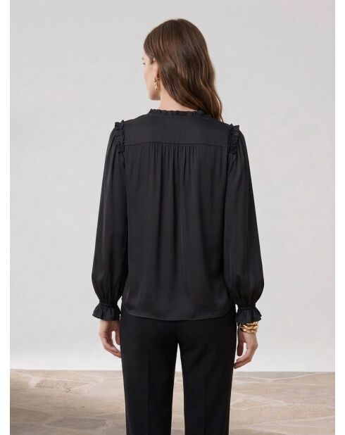 Top nero con volant