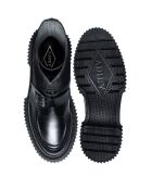 Bottes hautes à boucle en cuir et fermeture éclair noires