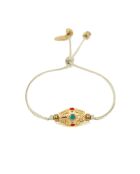 Pulsera Kamala de eslabones dorados, turquesas y rojos de latón nude