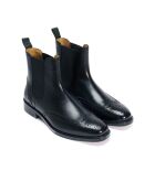 Bottines Chelsea à bout golf en cuir noires