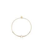 Brazalete con forma de estrella hueca en oro fino y beige
