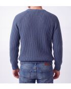 Jersey romano de lana con cuello redondo y mangas raglán, jeans azules