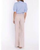 Blusa azul claro con cuello anudado