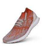 Baskets running Ultraboost Uncaged orange/blanc